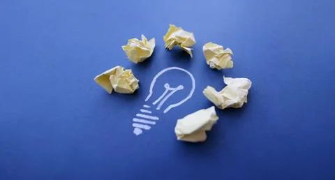Chalk lightbulb with crumpled papers, creativity and inspiration Stock Photos