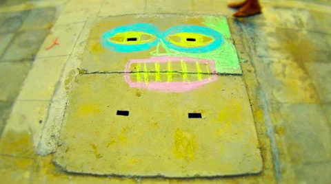 Chalk portrait drawing process on concrete drain. Time lapse Stock Footage 37350535