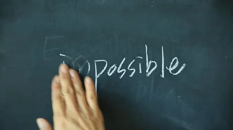 Chalk writing - Impossible and deleting im on chalkboard Stock Footage 68113882