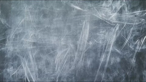 Chalkboard chalk scratch marks shifting and erasing across dark classroom b.. 스톡 동영상 339791269