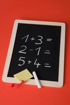A chalkboard with math problems written on it 스톡 사진