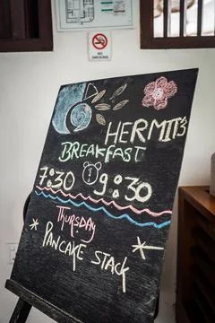 Chalkboard menu announcing breakfast special at resort Stock Photos