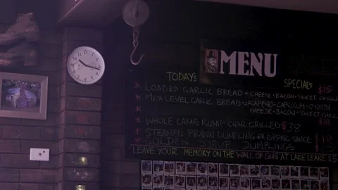 Chalkboard Pub Menu With Clock And Photo Wall Interior Stock Footage 340497769