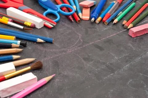 Chalkboard with school tools Stock Photos