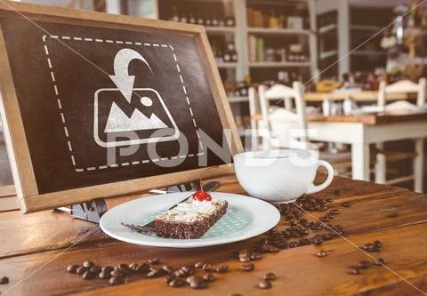 Chalkboard with slice of cake and coffee cup on a table in cafeteria PSD Template