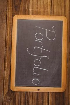 Chalkboard on table with portfolio text Stock Photos