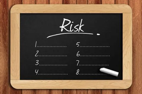 Chalkboard on the wooden table written risk list Foto stock