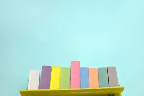 Chalks for drawing colored set take out from the open cardboard box. childr.. Stock Photos