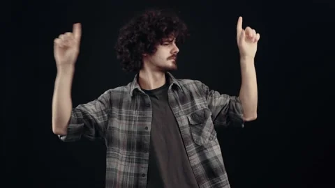 The chalky, charismatic boy performs relaxed movements under the rhythm of dance Stock Footage 154313682