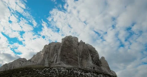 Chalky rock against the background of blue sky and floating clouds. Stock Footage 131114103
