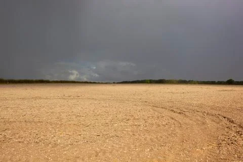 Chalky soil and dramatic sky Stock Photos