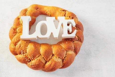 Challah, braided bread ring. Round white wheat bread with coarse salt and the Stock Photos