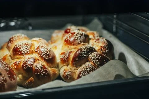 Challah bread baking in the oven Stock Photos
