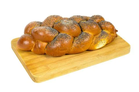 Challah bread on chopping board Stock Photos