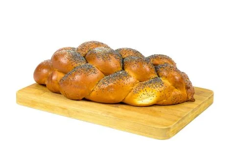 Challah bread on chopping board Stock Photos