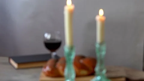 Challah bread, shabbat wine and candles on wooden table. Stock Footage 159446497