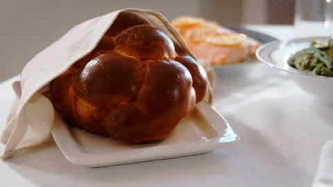 Challah bread on a table set for Jewish Shabbat, close up Stock Footage 86606028