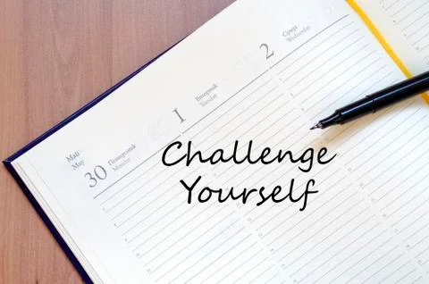 Challenge yourself write on notebook Stock Photos
