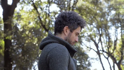 Challenge,future.Attractive man in the park looking up the sky Stock Footage 118600974