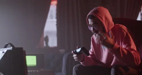 Challenging man playing videogame in cafe Stock Footage 229483387