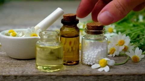 Chamomile extract in a small bottle. Selective focus. Stock Footage 156545205