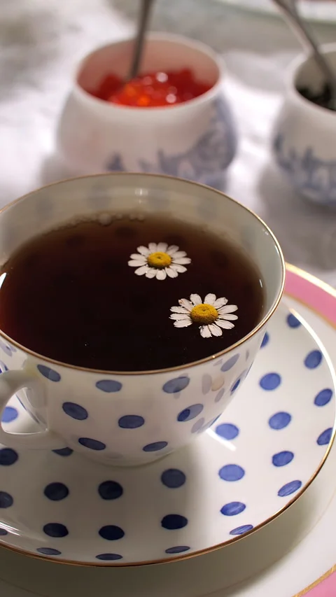 Chamomile Tea in Polka Dot Cup with Caviar Bowls Video stock 282673841