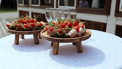 Champagne with appetizers on the buffet table. Buffet table, canape with cheese Stock Footage 253322885