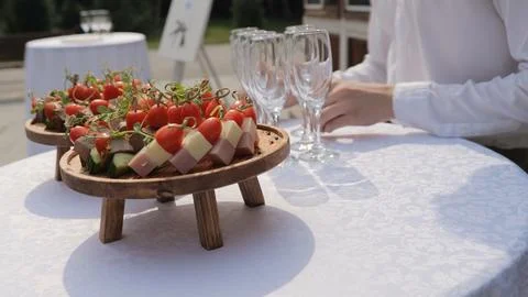 Champagne with appetizers on the buffet table. Buffet table, canape with cheese Stock Photos