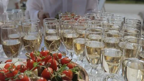 Champagne with appetizers on the buffet table. Buffet table, canape with cheese Stock Photos
