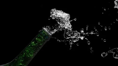 Champagne Bottle Exploding with Water Splash on Black Background Vídeo Stock 348305666