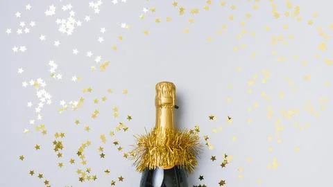Champagne bottle with star spangles Stock Photos