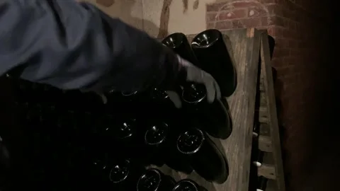 Champagne Bottles Riddling in Cellar Stock Footage 320860726