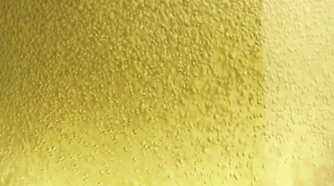 Champagne bubbles inside a flute, golden texture effect Stock Footage 59932750