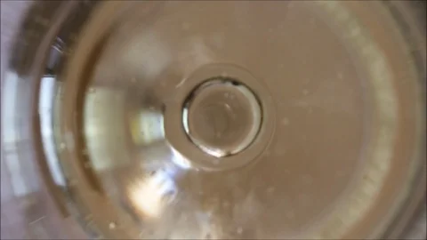 Champagne bubbles rising up and exploding Stock Footage 91914537