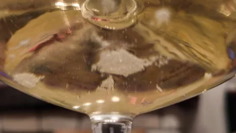 Champagne bubbles viewed from below glass 스톡 동영상 345836001