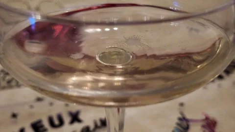 Champagne bubbles viewed from below glass 스톡 동영상 345836041