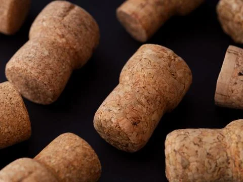 Champagne corks on a black background. Stock Photos