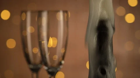 Champagne explosion,  two glasses stand side by side. Holiday Bokeh Blinking Stock-Footage 140102552