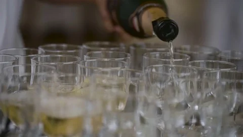 Champagne at the feast spilled over the wine glasses, a familiar attribute of Stock Footage