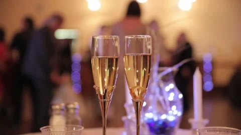 Champagne glasses in the foreground Stock Footage 176916325
