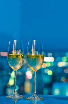 Champagne glasses in front of a window Stock Photos