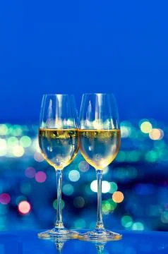 Champagne glasses in front of a window Stock Photos