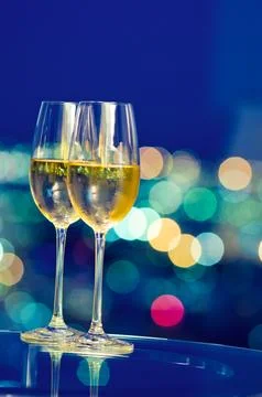 Champagne glasses in front of a window Stock Photos