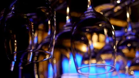 Champagne glasses hanging on the rack Stock Footage