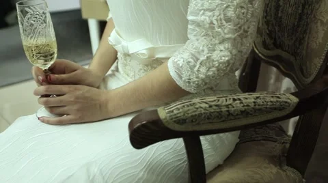 Champagne in a hand of the bride Stock Footage 61687906