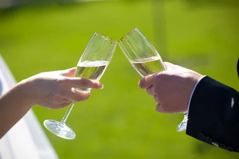 Champagne in hands Stock Photos