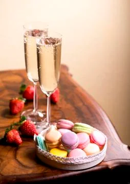 Champagne with macaroons Stock Photos
