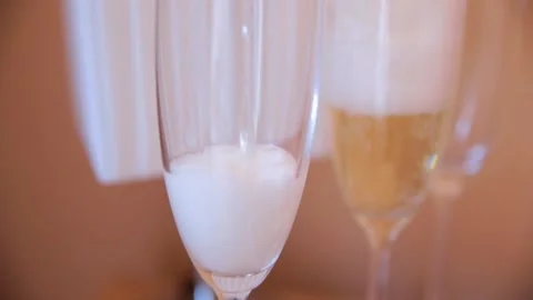 Champagne is poured into a glass Stock Footage 164870609