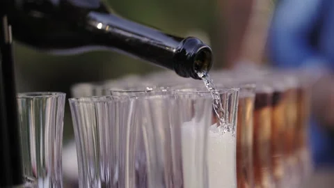 Champagne is poured into glasses close-up Stock Footage 220115178