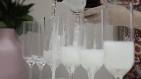 Champagne is poured into glasses Stock Footage 146574099
